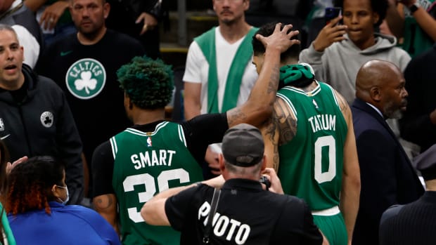 May 29, 2023; Boston, Massachusetts, USA; Boston Celtics forward Jayson Tatum (0) and guard Marcus Smart (36) react after the loss against the Miami Heat in game seven of the Eastern Conference Finals for the 2023 NBA playoffs at TD Garden.