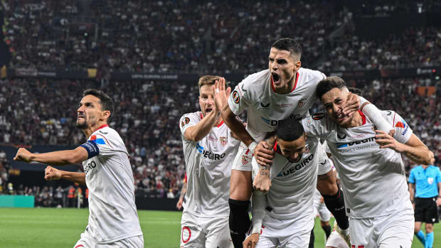 Players from Sevilla pictured celebrating a goal against Roma in the 2023 UEFA Europa League final