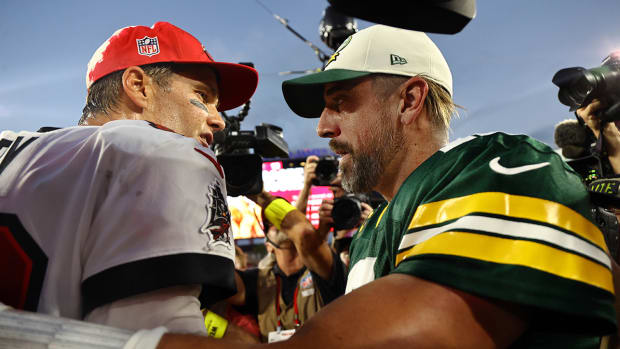 Buccaneers quarterback Tom Brady (12) and Packers quarterback Aaron Rodgers (12) greet after the game at Raymond James Stadium.