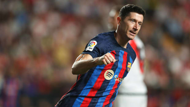 Robert Lewandowski pictured celebrating after scoring a goal for Barcelona against Rayo Vallecano in April 2023