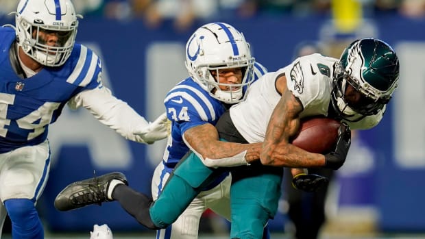 Colts cornerback Isaiah Rodgers tackles Eagles wide receiver DeVonta Smith in Dec. 2022.