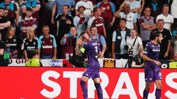Fiorentina captain Cristiano Biraghi pictured with blood flowing from a cut on his head after being struck by an object thrown by West Ham fans during the 2023 UEFA Europa Conference League final