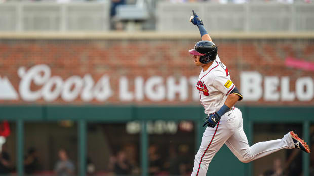 Jun 8, 2023; Cumberland, Georgia, USA; Atlanta Braves third baseman Austin Riley (27) reacts after hitting a two run home run against the New York Mets during the first inning at Truist Park. Mandatory Credit: Dale Zanine-USA TODAY Sports
