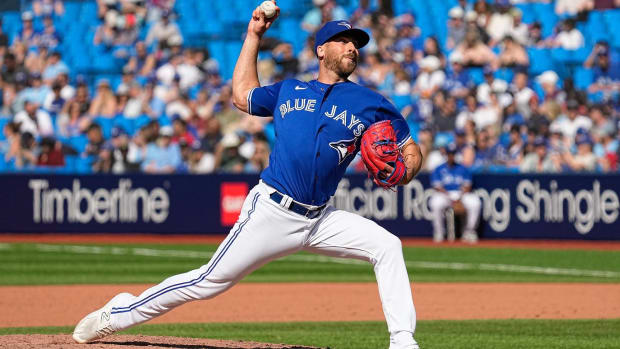 Blue Jays pitcher Anthony Bass throws a pitch in a game vs. the Rays.