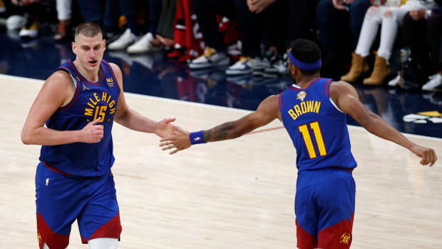 Jun 1, 2023; Denver, CO, USA; Denver Nuggets center Nikola Jokic (15) and forward Bruce Brown (11) celebrate during the second half in game one of the 2023 NBA Finals against the Miami Heat at Ball Arena.