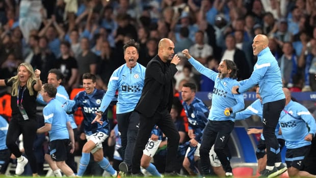 Pep Guardiola pictured (center) seconds after the last whistle had been blown in the 2023 UEFA Champions League final, which saw his Manchester City team beat Inter Milan 1-0