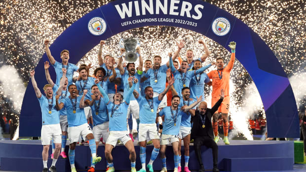 Manchester City's players pictured celebrating with the European Cup trophy after winning the 2023 Champions League final