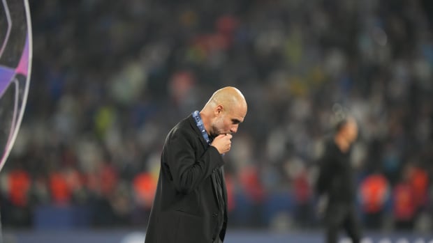 Manchester City manager Pep Guardiola pictured kissing his gold medal after his team beat Inter Milan in the 2023 UEFA Champions League final