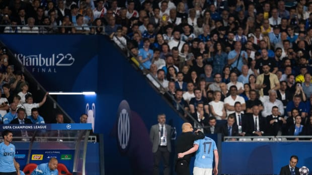 Manchester City manager Pep Guardiola pictured hugging Kevin De Bruyne (no.17) after the midfielder was forced off with an injury during the 2023 UEFA Champions League final against Inter Milan