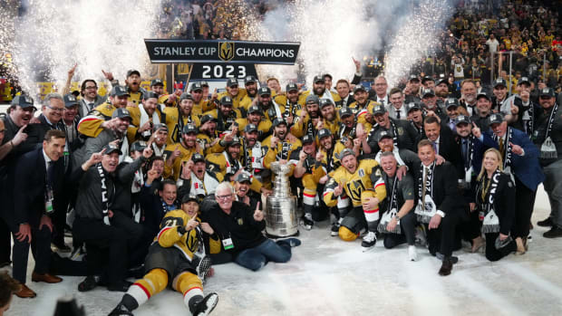Jun 13, 2023; Las Vegas, Nevada, USA; The Vegas Golden Knights pose with the Stanley Cup after defeating the Florida Panthers in game five of the 2023 Stanley Cup Final at T-Mobile Arena.