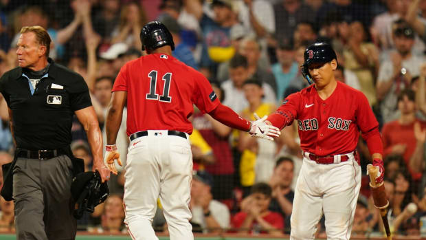 Boston Red Sox third baseman Rafael Devers and left fielder Masataka Yoshida