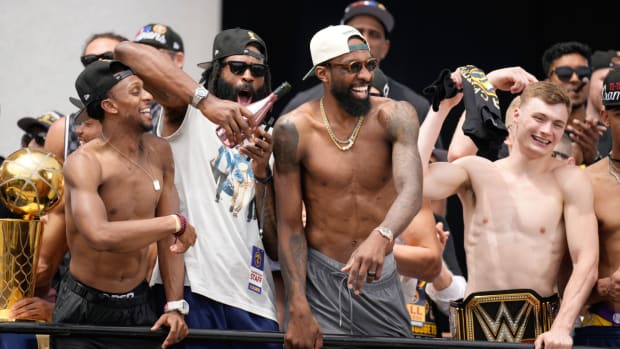 From left, Denver Nuggets guard Ish Smith, center DeAndre Jordan, forward Jeff Green and guard Christian Braun celebrate during a rally and parade to mark the team’s first NBA basketball championship on Thursday, June 15, 2023, in Denver. (AP Photo/David Zalubowski)