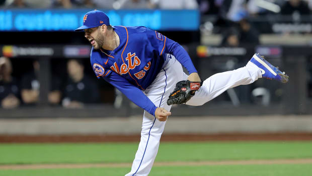Jun 14, 2023; New York City, New York, USA; New York Mets relief pitcher Dominic Leone (50) follows through on a pitch against the New York Yankees during the tenth inning at Citi Field.