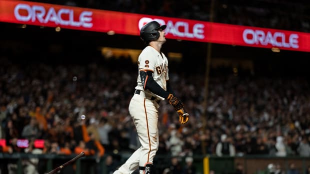 SF Giants right fielder Mike Yastrzemski watches his three-run home run against the San Diego Padres for a walk-off win during the tenth inning at Oracle Park on June 19, 2023.