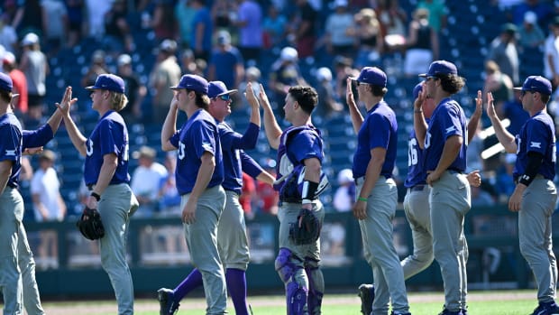 Jun 20, 2023; Omaha, NE, USA; The TCU Horned Frogs celebrate the win against the Oral Roberts Golden Eagles at Charles Schwab Field Omaha.