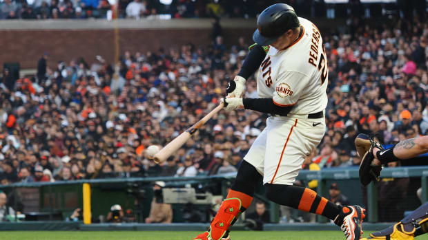 SF Giants designated hitter Joc Pederson hits an RBI single during the fifth inning at Oracle Park on June 21, 2023.