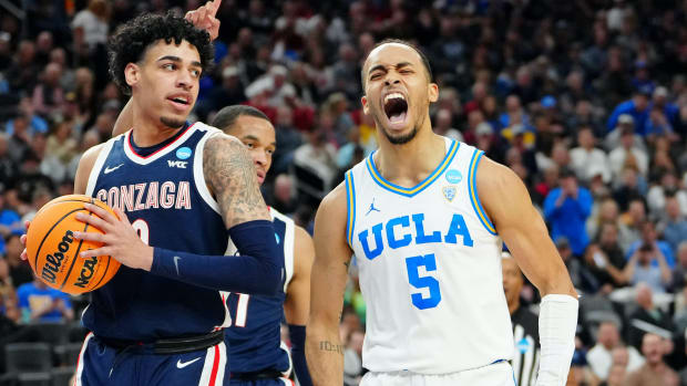 Mar 23, 2023; Las Vegas, NV, USA; UCLA Bruins guard Amari Bailey (5) reacts after a play against the Gonzaga Bulldogs during the first half at T-Mobile Arena.