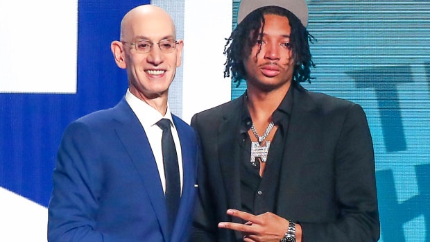 Nick Smith, Jr., with NBA commissioner Adam Silver at NBA Draft