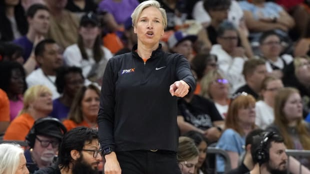 Mercury head coach Vanessa Nygaard calls out a play in a game.