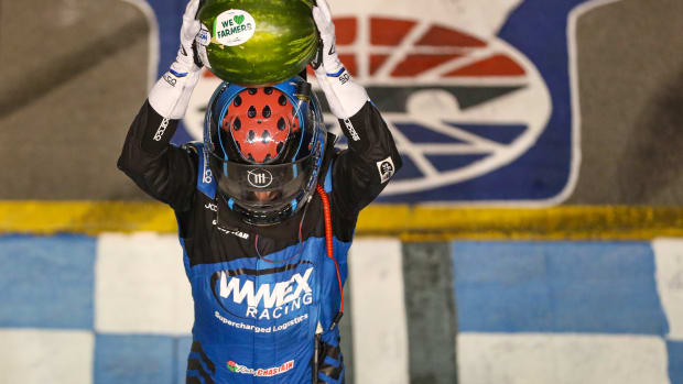 Ross Chastain celebrates with a watermelon after winning the NASCAR Cup Series Ally 400 at Nashville Superspeedway on Sunday in Lebanon, Tennessee. (Photo by Meg Oliphant/Getty Images)