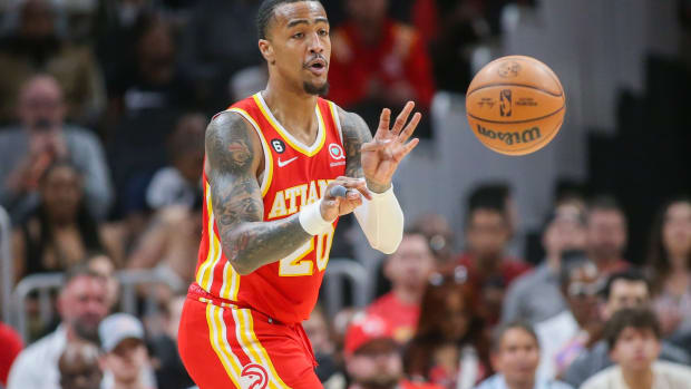 Atlanta Hawks forward John Collins (20) passes the ball against the Indiana Pacers in the first quarter at State Farm Arena.