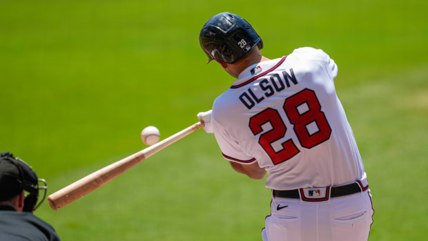 Jun 28, 2023; Cumberland, Georgia, USA; Atlanta Braves first baseman Matt Olson (28) hits a double to drive in a run against the Minnesota Twins during the first inning at Truist Park. Mandatory Credit: Dale Zanine-USA TODAY Sports
