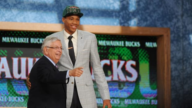 Giannis Antetokounmpo poses for a photo with NBA commissioner David Stern after being selected as the number fifteen overall pick to the Milwaukee Bucks during the 2013 NBA Draft