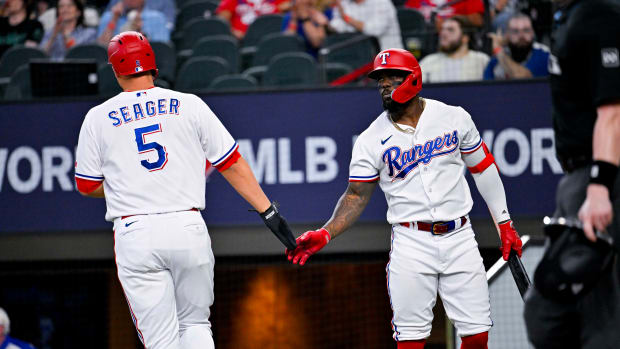 Jun 3, 2023; Arlington, Texas, USA; Texas Rangers shortstop Corey Seager (5) and right fielder Adolis Garcia (53) celebrate after Seager scores against the Seattle Mariners during the second inning at Globe Life Field. Mandatory Credit: Jerome Miron-USA TODAY Sports