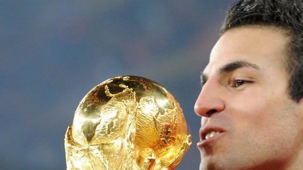 Cesc Fabregas pictured kissing the FIFA World Cup trophy in 2010 after Spain's victory over the Netherlands in the final