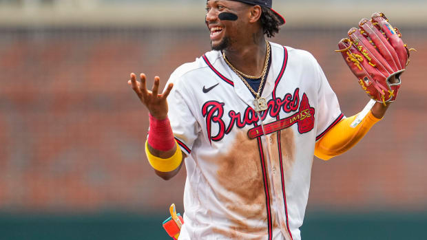 Jul 2, 2023; Cumberland, Georgia, USA; Atlanta Braves right fielder Ronald Acuna Jr. (13) reacts after the Braves defeated the Miami Marlins at Truist Park.