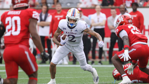 Sep 17, 2022; Houston, Texas, USA; Kansas Jayhawks wide receiver Lawrence Arnold (2) runs with the ball during the second quarter against the Houston Cougars at TDECU Stadium. Mandatory Credit: Troy Taormina-USA TODAY Sports