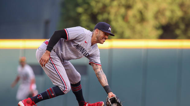Minnesota Twins shortstop Carlos Correa fields a ground ball against the Atlanta Braves in the first inning at Truist Park. (2023)