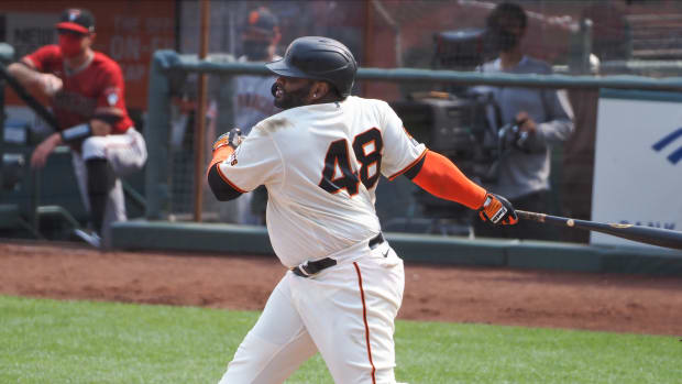 SF Giants designated hitter Pablo Sandoval hits an RBI single during the eighth inning against the Arizona Diamondbacks at Oracle Park. (2020)