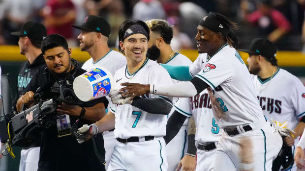 Diamondbacks outfielder Corbin Carroll (7) celebrates a walk-off win with Geraldo Perdomo (2) after his RBI single in the 10th defeated the Pittsburgh Pirates 3-2 at Chase Field.