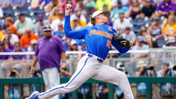 Jun 25, 2023; Omaha, NE, USA; Florida Gators starting pitcher Hurston Waldrep (12) throws a pitch against the LSU Tigers during the first inning at Charles Schwab Field Omaha. Mandatory Credit: Dylan Widger-USA TODAY Sports