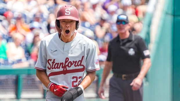 Jun 17, 2023; Omaha, NE, USA; Stanford Cardinal center fielder Eddie Park (22) celebrates after scoring against the Wake Forest Deacons on a hit batsman during the first inning at Charles Schwab Field Omaha. Mandatory Credit: Dylan Widger-USA TODAY Sports