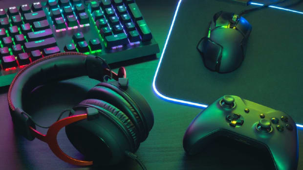 Glow-in-the-dark gaming gear on a desk.