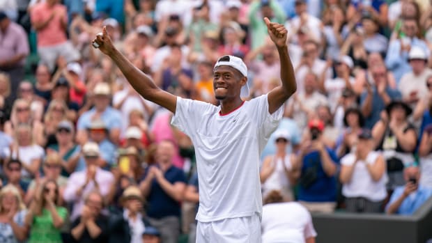 Christopher Eubanks celebrates after winning a match at Wimbledon