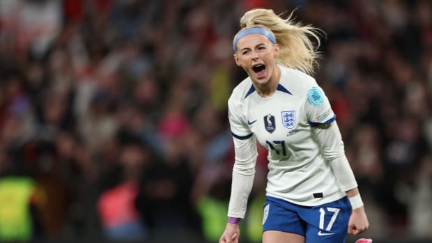 England forward Chloe Kelly celebrates scoring the winning penalty kick against Brazil.