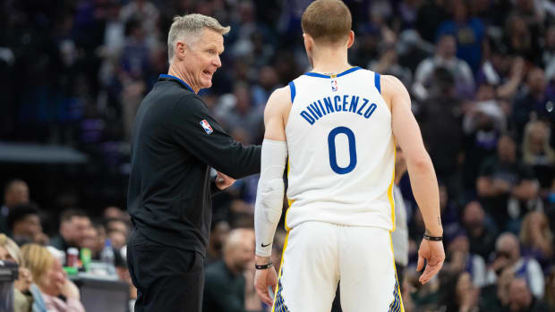 April 17, 2023; Sacramento, California, USA; Golden State Warriors head coach Steve Kerr (left) talks to guard Donte DiVincenzo (0) during the second quarter in game two of the first round of the 2023 NBA playoffs against the Sacramento Kings at Golden 1 Center. Mandatory Credit: Kyle Terada-USA TODAY Sports
