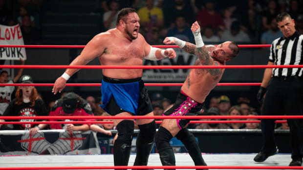 CM Punk flails after being hit by Samoa Joe