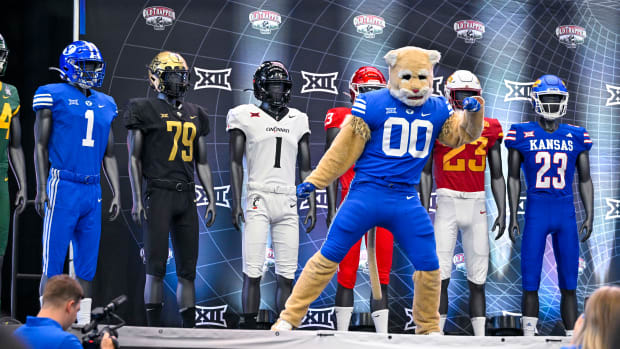 Jul 12, 2023; Arlington, TX, USA; The BYU Cougars mascot dances on the ESPN stage during Big 12 football media day at AT&T Stadium. Mandatory Credit: Jerome Miron-USA TODAY Sports