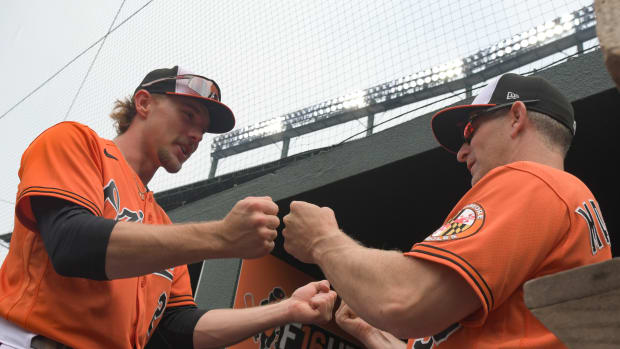 Jul 1, 2023; Baltimore, Maryland, USA; Baltimore Orioles third baseman Gunnar Henderson (2) fist bumps third base coach Tony Mansolino (36) before the game against the Minnesota Twins at Oriole Park at Camden Yards.