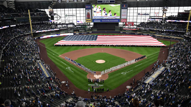 Apr 3, 2023; Milwaukee, Wisconsin, USA; Players line up for Opening Day ceremony at American Family Field before game between the Milwaukee Brewers and New York Mets.