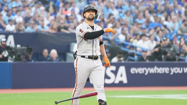 SF Giants third baseman J.D. Davis (7) reacts after being called out on strikes against the Toronto Blue Jays (2023)