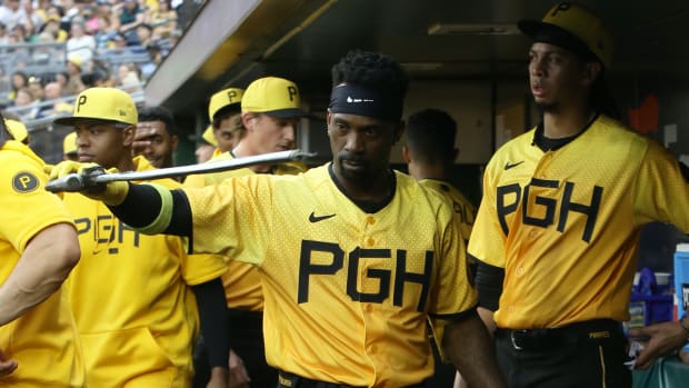 Jun 30, 2023; Pittsburgh, Pennsylvania, USA; Pittsburgh Pirates designated hitter Andrew McCutchen (22) celebrates in the dugout after hitting a solo home run against the Milwaukee Brewers during the fourth inning at PNC Park.