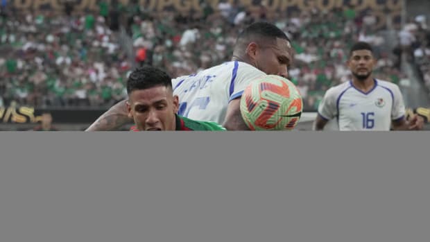 Mexico forward Uriel Antuna (left) and Panama defender Eric Davis (15) battle for the ball in the first half during the CONCACAF Gold Cup Final at SoFi Stadium.