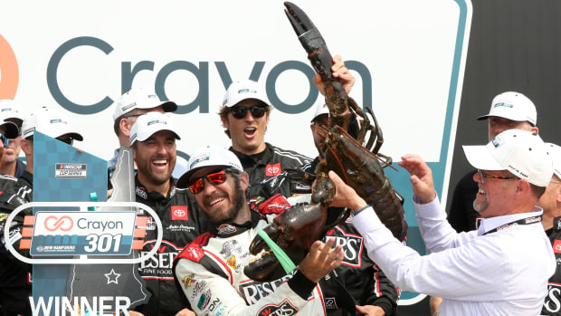 Martin Truex Jr. is presented Loudon the Lobster in victory lane after winning Monday's rescheduled NASCAR Cup Series Crayon 301 at New Hampshire Motor Speedway. (Photo by Meg Oliphant/Getty Images)