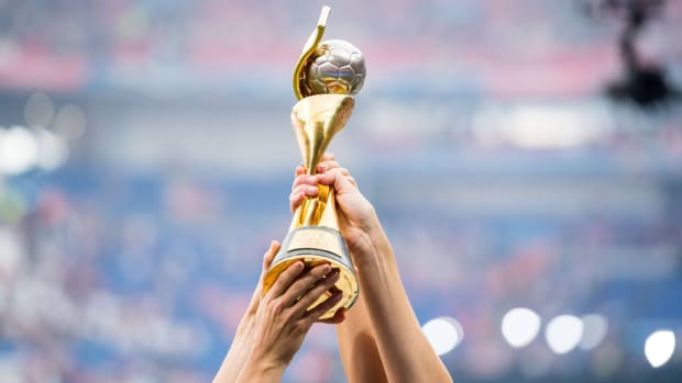 The Women's World Cup trophy is held up in celebration in 2019.