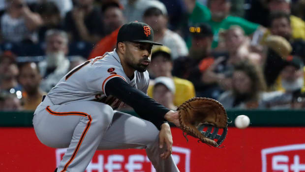 SF Giants first baseman LaMonte Wade Jr. takes a throw to retire Pittsburgh Pirates center fielder Jack Suwinski (not pictured) during the fifth inning at PNC Park. (2023)